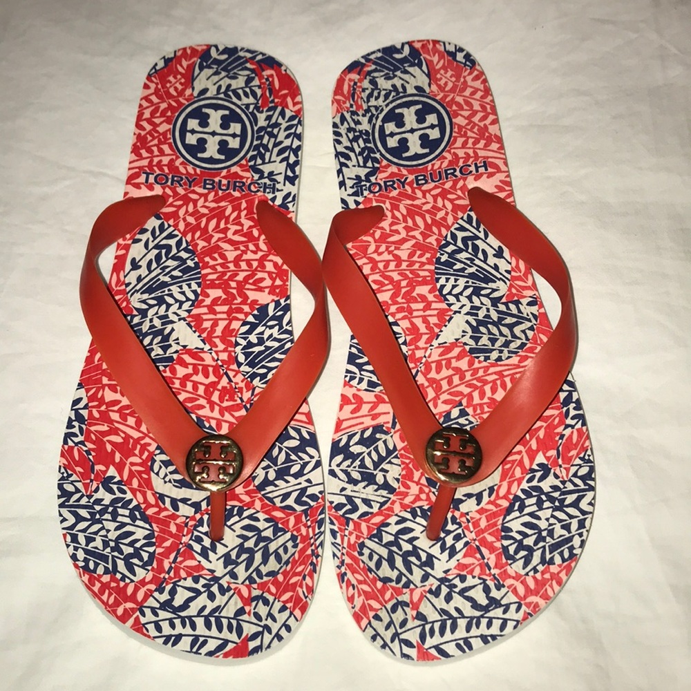 Tory Burch orange, white, and blue flip flops